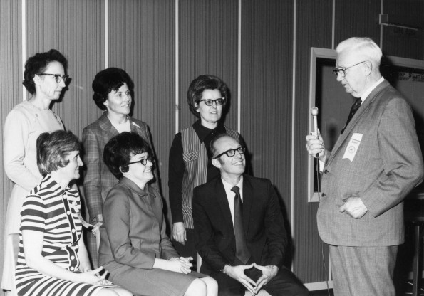 [Alumni listening to their former class sponsor during Andrews University's 1971 homecoming]