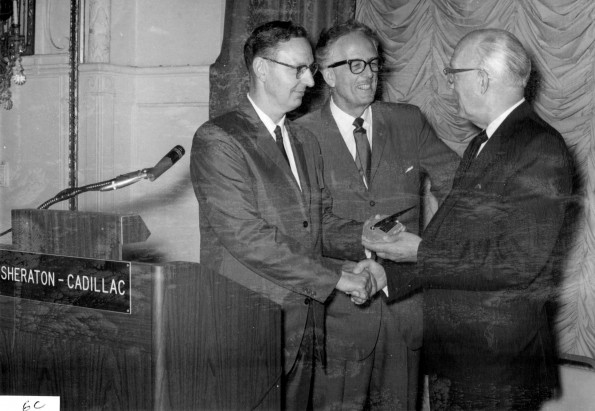 Emil Leffler receiving citation as honored alumnus from Winton Beaven and Horace Shaw at the alumni reunion luncheon at the Sheraton-Cadillac Hotel, Detroit, Michigan, during the 1966 General Conference Session