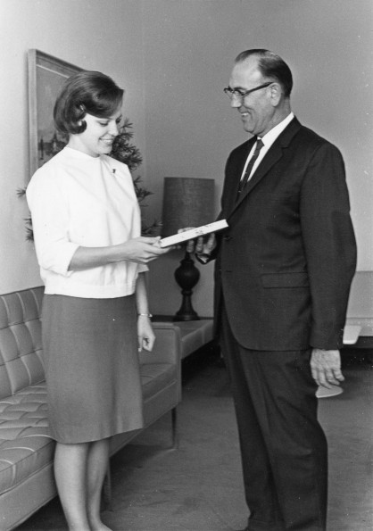 [Linda Boothby receiving a package from Albert Bauer for ingathering]