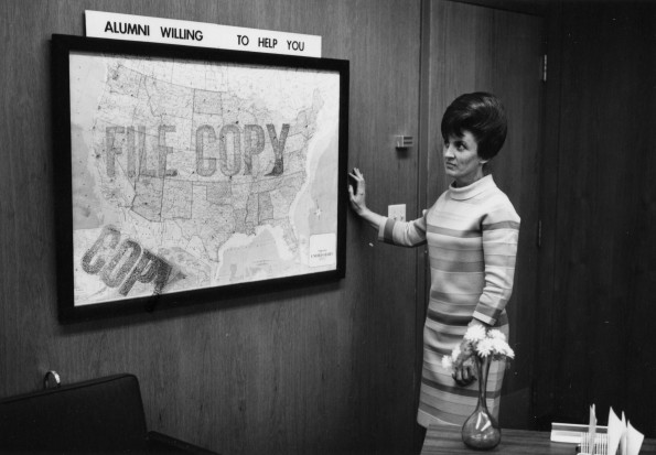 Donna Webb at the Andrews University Placement Center looking at the United States map showing where alumni willing to help you are located