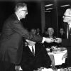 L. M. Peterson (Andrews University alumnus) receives a gift from Horace Shaw
