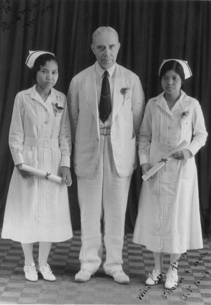Harry Miller with two graduate nurses, Phoebe and Grace