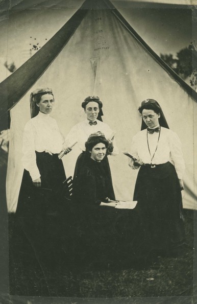 [Effie Gilbert and Cora Briggs with to other unknown girls at a camp meeting]