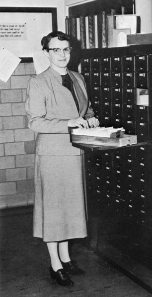 [Barbara H. Phipps standing by the card catalogue