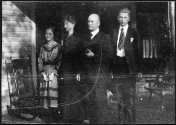 [E. A. Sutherland and family on front porch]