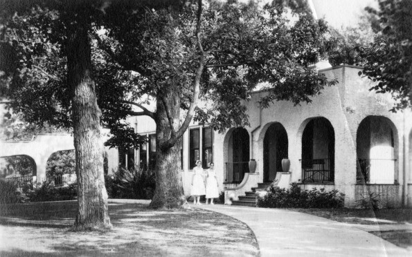 Two unknown women in front of one of the buildings at Madison Sanitarium