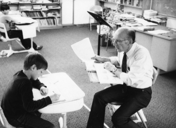 Harold Hiday assisting a student at the Mountain Home Seventh-day Adventist School