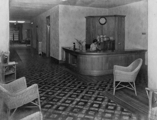Unknown woman operating the local swirchboard in the lobby of the Madison Sanitarium Administration Building