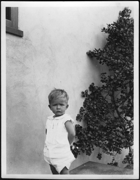 William Brunie aged 19 months posing by plant