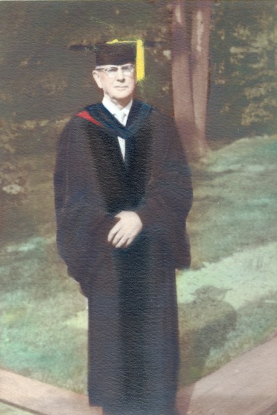 Roland E. Loasby in graduation regalia